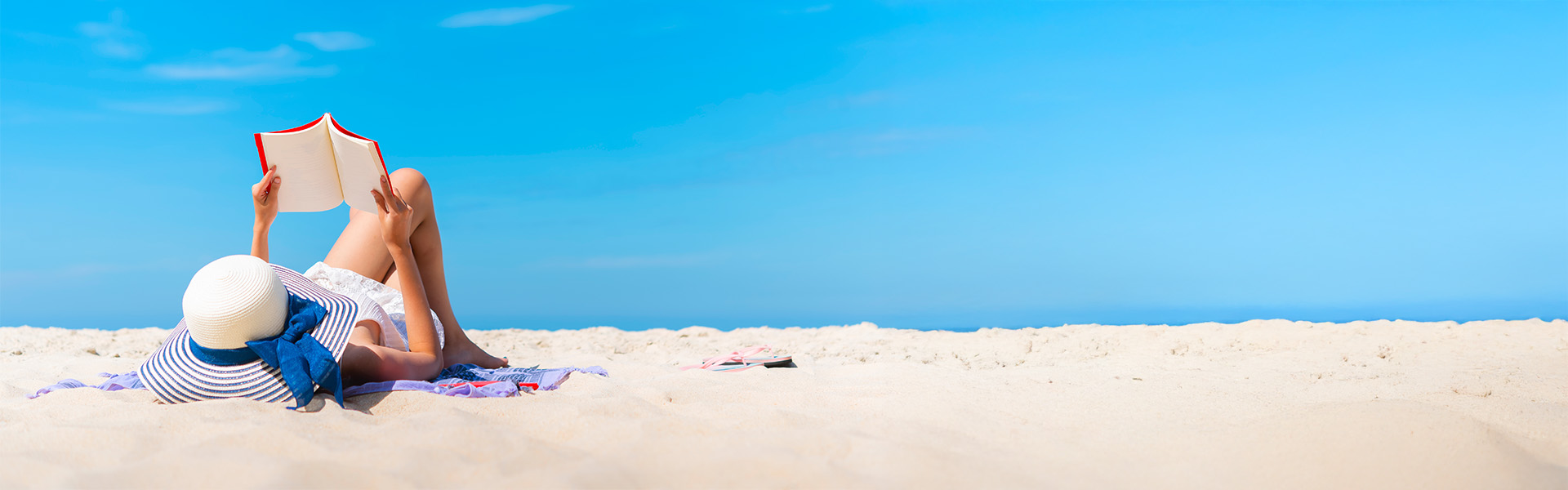 Relaxing on a beach while reading