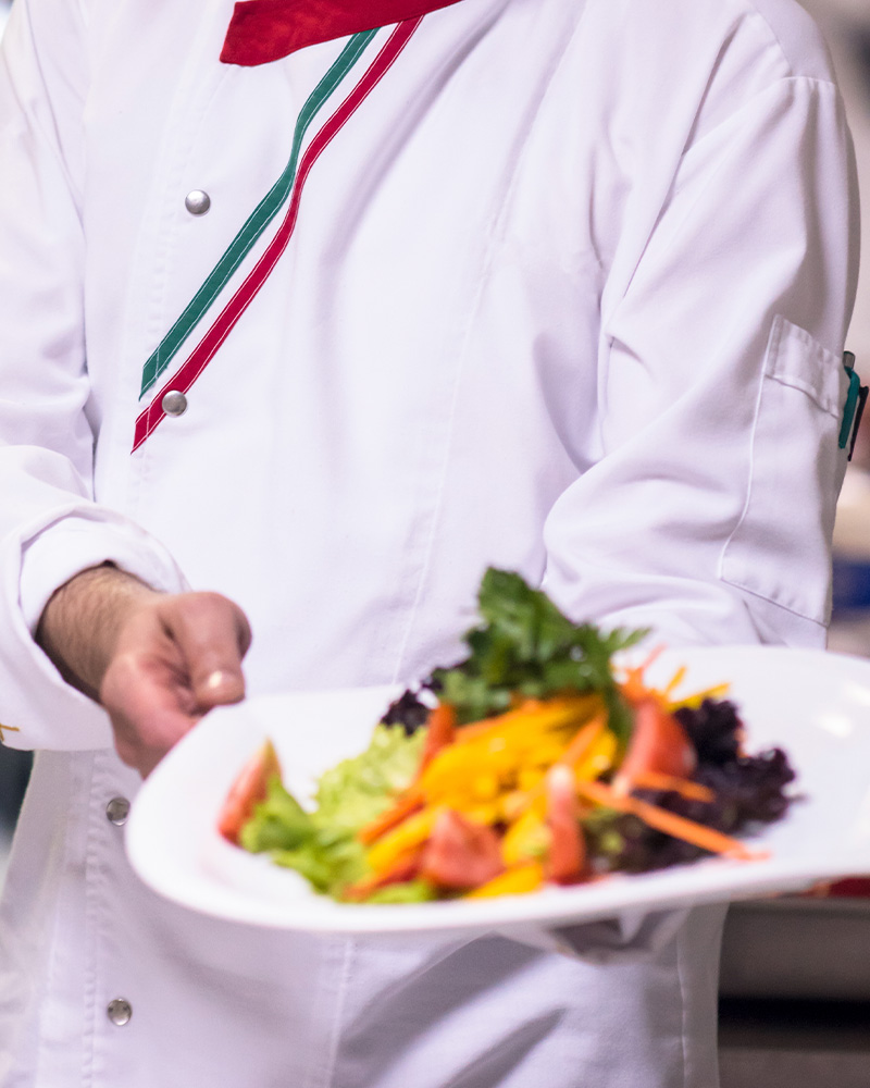 Chef plating gourmet Mexican dish